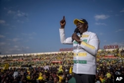 Kenyan presidential candidate William Ruto addresses supporters at his final election campaign rally, at Nyayo stadium, in Nairobi, Kenya, Aug. 6, 2022.