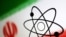 FILE - The atom symbol and the Iranian flag are seen in this photo illustration created July 21, 2022.