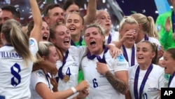England players celebrate after the Women's Euro 2022 final soccer match between England and Germany, at Wembley stadium in London, July 31, 2022.