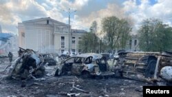 Destroyed vehicles are seen at the site of a Russian military strike in Vinnytsia, Ukraine July 14, 2022. (Press service of the State Emergency Service of Ukraine/Handout via Reuters)