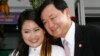 FILE - Ousted Thai Prime Minister Thaksin Shinawatra, who was deposed in a bloodless 2006 coup, poses with his daughter Paetongtarn during her graduation day at a Bangkok university, July 10, 2008. 