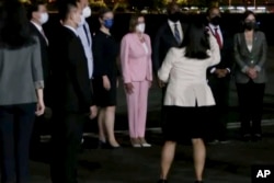 FILE - In this image taken from video, U.S. House Speaker Nancy Pelosi, center, arrives in Taipei, Taiwan, Aug. 2, 2022. (Taiwan Ministry of Foreign Affairs via AP)