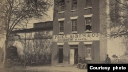 In 1861, during the U.S. Civil War, Union troops liberated the slave pen. The Union army used the pen to house Confederate prisoners. Here, a Union army guard stands at the entrance of the building, which was owned by different slave-trading firms. (National Archives) 