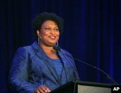 Democrat Stacey Abrams hopes to unseat incumbent Republican Gov. Brian Kemp in hopes of becoming the country's first-ever Black woman governor. (AP Photo/Akili-Casundria Ramsess, File)