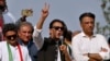 FILE - Pakistan’s former Prime Minister Imran Khan, center, speaks during a rally in Islamabad, May 26, 2022. Police arrested Shahbaz Gill, a close associated of Khan, Aug. 9, 2022, for allegedly inciting army officers to mutiny.
