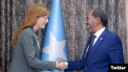 Somali President Hassan Sheikh Mohamud, right, greets USAID administrator Samantha Power during her visit to Mogadishu, July 25, 2022. (Twitter @TheVillaSomalia)