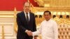 Russian Foreign Minister Sergei Lavrov (R) shakes hands with Myanmar Min Aung Hlaing, Senior General and Chairman of the State Administration Council in Naypyidaw, on August 3, 2022. (Photo by HANDOUT / RUSSIAN FOREIGN MINISTRY / AFP)