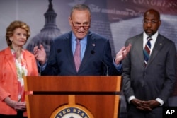 FILE - Senate Majority Leader Chuck Schumer speaks to reporters after the Senate advanced a $280 billion bill designed to boost the U.S. semiconductor industry, at the Capitol in Washington, July 26, 2022.