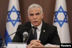 FILE - Israeli Prime Minister Yair Lapid attends a cabinet meeting at the prime minster’s office in Jerusalem, July 17, 2022.