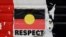 FILE - A sticker of the Australian Aboriginal Flag along with the word 'RESPECT' is pictured on a structure at the Aboriginal Tent Embassy, a site of protest since 1972, in Canberra, Australia, May 4, 2022.