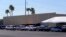 Dozens of vehicles line up to get provisions at St. Mary's Food Bank on June 29, 2022, in Phoenix. Long lines are back at food banks around the U.S., as Americans overwhelmed by inflation and higher gas prices seek help feeding their families.