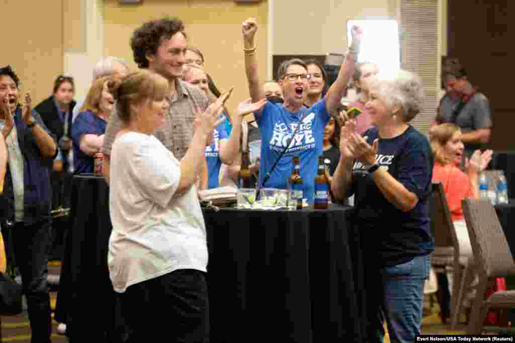 Abortion-rights supporters react as early polls showed that voters rejected a state constitutional amendment that would have declared there is no right to abortion, at a Kansans for Constitutional Freedom election watch party in Overland Park, Kansas, Aug. 2, 2022.