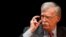 FILE - Former White House national security adviser John Bolton adjusts his glasses during his lecture at Duke University in Durham, North Carolina, Feb. 17, 2020. 