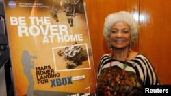 Trailblazing actress Nichelle Nichols, who played the character Uhura in the original "Star Trek" TV series, poses at NASA's Jet Propulsion Lab in Pasadena, California, Aug. 5, 2012.