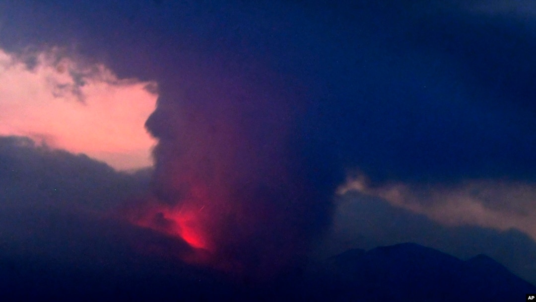 This long exposure image shows the eruption of volcano Sakurajima Sunday night, July 24, 2022, in the view from Tarumizu city, Japan's southern prefecture of Kagoshima. Japan’s Meteorological Agency said a volcano on Japan’s southern main island of Kyushu