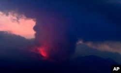 This long exposure image shows the eruption of volcano Sakurajima the night of July 24, 2022.