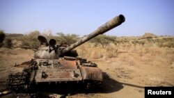 FILE - A destroyed tank is seen amid fighting between the Ethiopian National Defense Force and the Tigray People's Liberation Front (TPLF) forces in Kasagita town, in Ethiopia's Afar region, Feb. 25, 2022. Renewed clashes have been reported in the country's Amhara region.