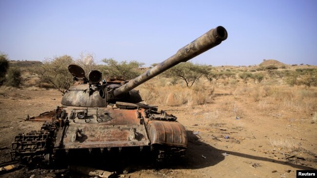 FILE - A destroyed tank is seen in a field in the aftermath of fighting between the Ethiopian National Defence Force and the Tigray People's Liberation Front (TPLF) forces in Kasagita town, in Afar region, Ethiopia, Feb. 25, 2022.