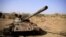 FILE - A destroyed tank is seen amid fighting between the Ethiopian National Defense Force and the Tigray People's Liberation Front (TPLF) forces in Kasagita town, in Ethiopia's Afar region, Feb. 25, 2022. Renewed clashes have been reported in the country's Amhara region.