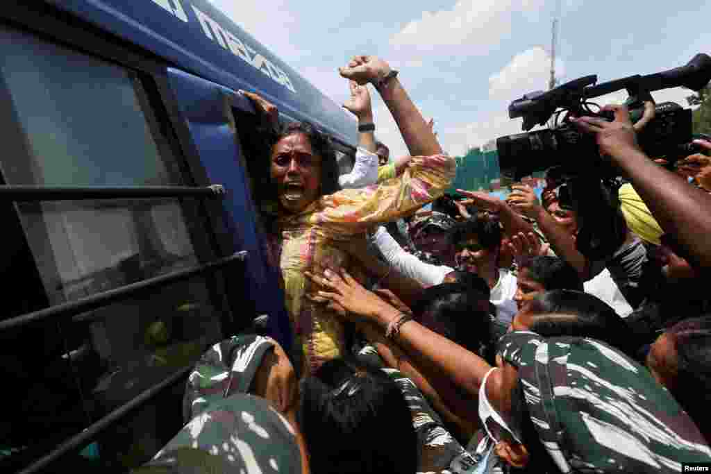 S. Jothimani, a lawmaker from India&#39;s main opposition Congress party reacts as she is being detained outside the Parliament in New Delhi.&nbsp; She and other lawmakers were protesting against the Enforcement Directorate summons to their party leader, increasing price hike and inflation in the country.