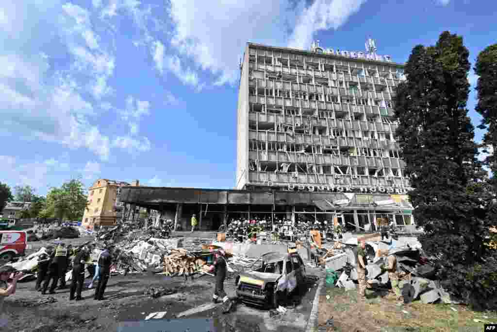 Firefighters remove rubble from a severely damaged building following a Russian airstrike in the city of Vinnytsia, Ukraine.