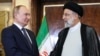 FILE - Russian President Vladimir Putin, left, shakes hands with Iranian President Ebrahim Raisi prior to their talks at the Saadabad palace, in Tehran, July 19, 2022. (Kremlin Pool Photo via AP)