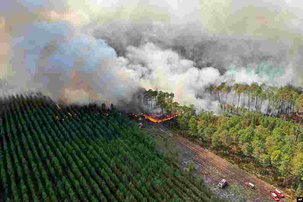 This photo provided by the fire brigade of the Gironde region (SDIS33) shows a wildfire burning near Landiras, southwestern France,.