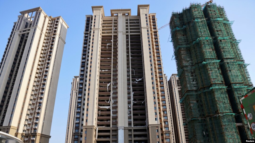 FILE - In China, many homebuyers have stopped paying their mortgage.