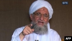 In this file handout picture released by the SITE Intelligence Group on Oct. 4, 2009 shows Ayman al-Zawahiri, the Al-Qaeda number two, giving a eulogy for Ibn al-Sheikh al-Libi.