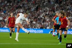 FILE - England's Georgia Stanway, centre, scores her side's second goal during the Women Euro 2022 quarter final soccer match between England and Spain at the Falmer stadium in Brighton, July 20, 2022.