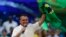 Brazil's President Jair Bolsonaro holds a Brazilian flag during a rally to launch his reelection bid, in Rio de Janeiro, Brazil, July 24, 2022.