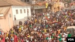 FILE: Members of Angola opposition party UNITA march. Taken 7.30.2022