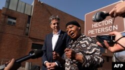 U.S. Secretary of State Antony Blinken, left, and Antoinette Sithole – the sister of a boy named Hector Pieterson who was killed at age 12 during the Soweto uprising – make a statement after visiting the Hector Pieterson Memorial in Soweto, on August 7, 2022.