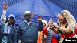 Kenya's opposition leader and presidential candidate Raila Odinga of the Azimio la Umoja (Declaration of Unity) coalition, joins performers at a campaign rally ahead of the forthcoming general election at the Kirigiti Stadium in Kiambu, Kenya August 1, 20