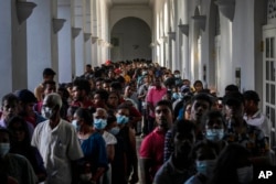 People throng President Gotabaya Rajapaksa's official residence three days after it was stormed by anti-government protesters in Colombo in Colombo, Sri Lanka, July 12, 2022.