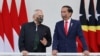 East Timor President Jose Ramos-Horta, left, talks to Indonesian President Joko Widodo, during their meeting at the Presidential Palace in Bogor, West Java, Indonesia, July 19, 2022. 