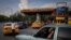 FILE: Drivers wait their turn to fuel their vehicles at a gas station in Havana, Cuba, July 14, 2022 