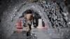 A child runs through a water fountain at Cinecitta World park, near Rome, Italy, July 23, 2022, during an ongoing heat wave across Europe. 