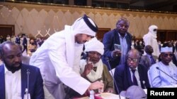 Officials attend a signing agreement for a national dialogue with Chad's transitional military authorities and rebels at Sheraton Hotel in Doha, Qatar, Aug. 8, 2022. 