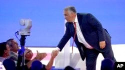Hungarian Prime Minister Viktor Orban shakes hands after speaking at the Conservative Political Action Conference in Dallas, Aug. 4, 2022.