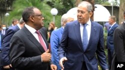 Russian Foreign Minister Sergey Lavrov, right, speaks with Ethiopian Deputy Prime Minister Demeke Mekonnen, left, as they visit the compound of the Russian Embassy in Addis Ababa, Ethiopia, July 27, 2022.