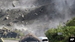 Huge rocks fall during an earthquake in Bauko, Mountain Province, Philippines.&nbsp;Scientists say the 7-magnitude quake was centered around Abra province in a mountainous area, killing at least five people and injuring dozens.