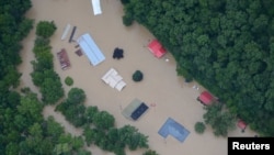 FILE - A flooded area is flown over by a Kentucky National Guard helicopter deployed in response to a declared state of emergency in eastern Kentucky, July 27, 2022. (US Army National Guard/Handout via Reuters)