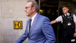 FILE: Actor Kevin Spacey leaves the Old Bailey, in London, Thursday, July 14, 2022. Spacey appeared Thursday in a court in London after he was charged with sexual offenses against three men. 