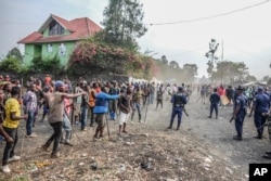 Demonstrators clash with police during a protest against the United Nations peacekeeping force MONUSCO deployed in the Democratic Republic of the Congo, in Sake, some 24 kilometers west of Goma, July 27, 2022.