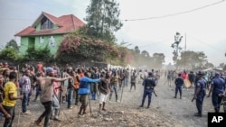 Demonstrators clash with police during a protest against the United Nations peacekeeping force MONUSCO deployed in the Democratic Republic of the Congo, in Sake, some 24 kilometers west of Goma, July 27, 2022.