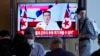 People watch TV news showing an image of North Korea leader Kim Jong Un, at the Seoul Railway Station in Seoul, South Korea, July 28, 2022. Kim warned he's ready to use his nuclear weapons in potential conflicts with the United States and South Korea, state media said.