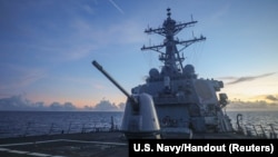 Arleigh Burke-class guided-missile destroyer USS Benfold (DDG 65), forward-deployed to the U.S. 7th Fleet area of operations, conducts underway operations in the South China Sea, in this handout picture released on July 13, 2022. 
