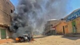 FILE: a view of a burning vehicle in the wake of clashes in Sudan's eastern city of Kassala, close to the border with Eritrea. - Thousands of members of the Hawsa tribe set up barricades and attacked government buildings across Sudan on 7.18.2022