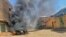 FILE: a view of a burning vehicle in the wake of clashes in Sudan's eastern city of Kassala, close to the border with Eritrea. - Thousands of members of the Hawsa tribe set up barricades and attacked government buildings across Sudan on 7.18.2022